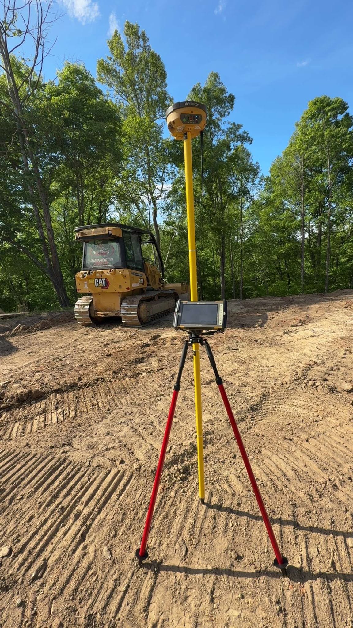 GNSS survey rover set up to check grade on a Wallburg Dirt Worx site