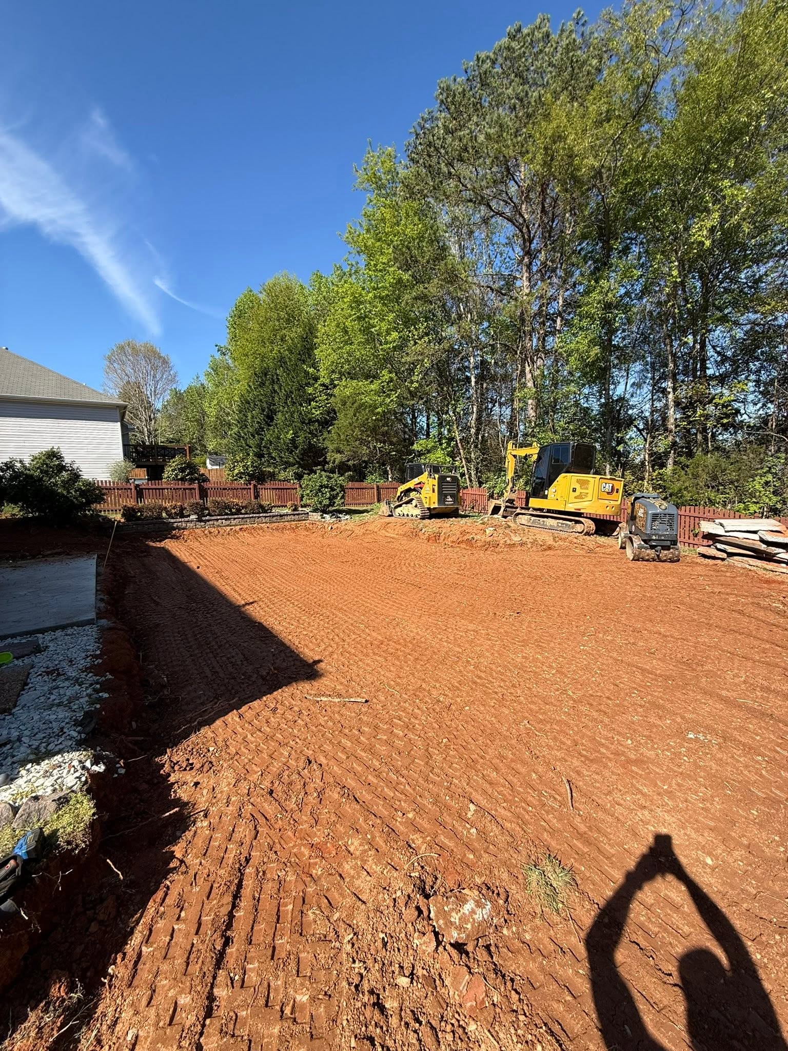 Backyard graded smooth and draining after Wallburg Dirt Worx finished