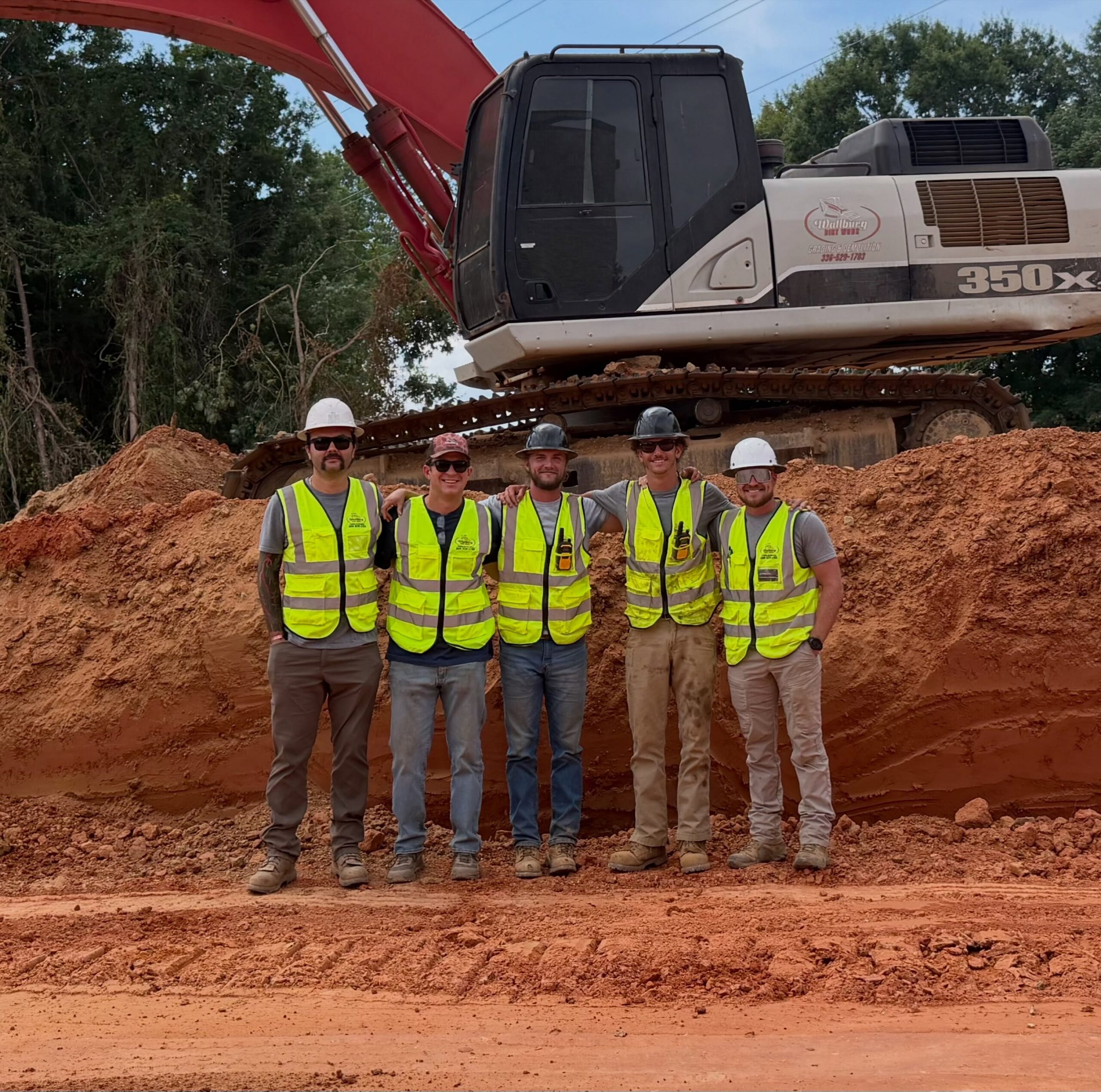 The Wallburg Dirt Worx crew in high visibility vests on a Triad job site