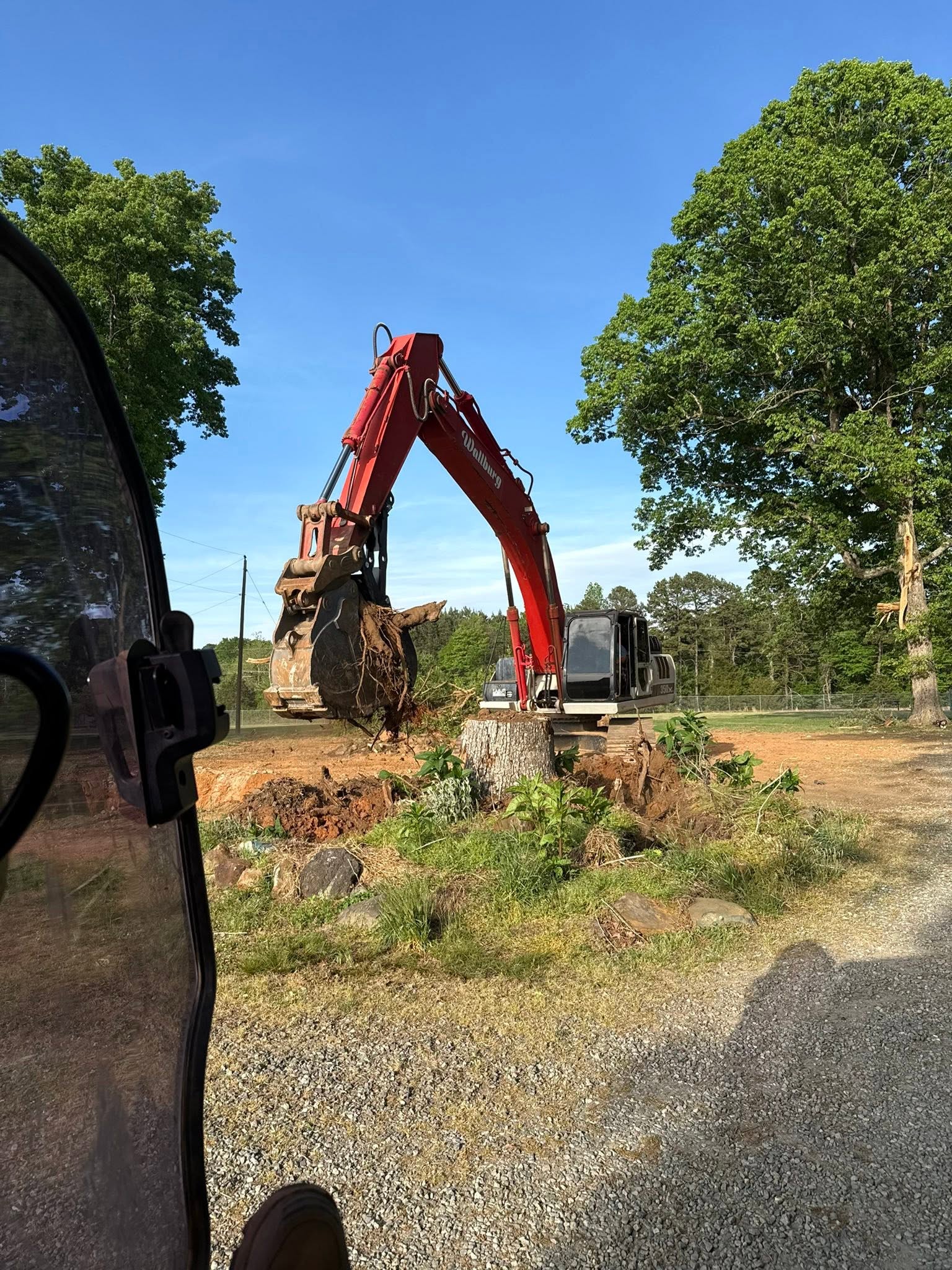 Excavator clearing land in the North Carolina Triad